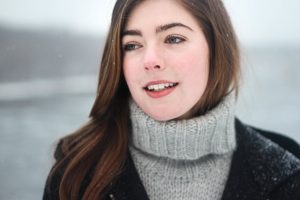 Young woman in snowing weather